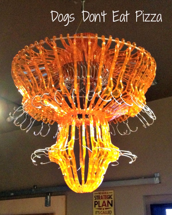 Chandelier made out of repurposed hangers in The Tinkering Room - thediybungalow.com