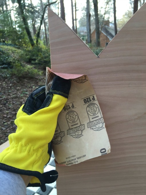 Sand the edges of the signs when making the DIY direction sign post - thediybungalow.com