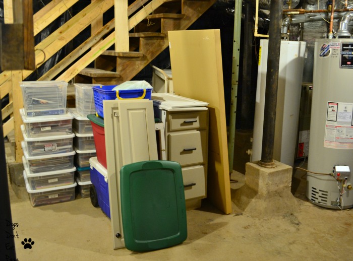 Put heavier items near the stairs so they are easier to move in how to organize an unfinished basement - thediybungalow.com