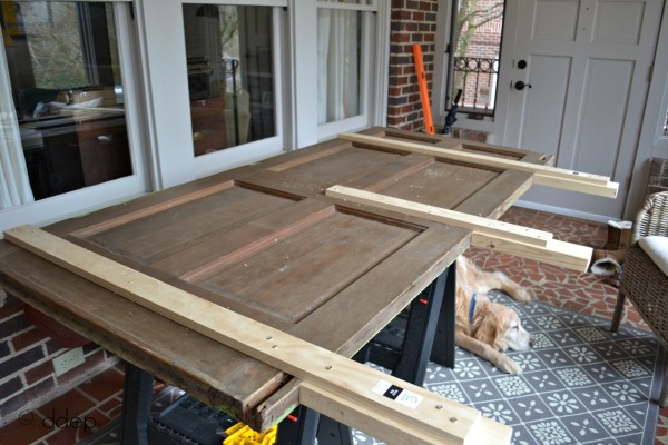 add braces to door headboard - how to build a daybed from old doors - thediybungalow.com