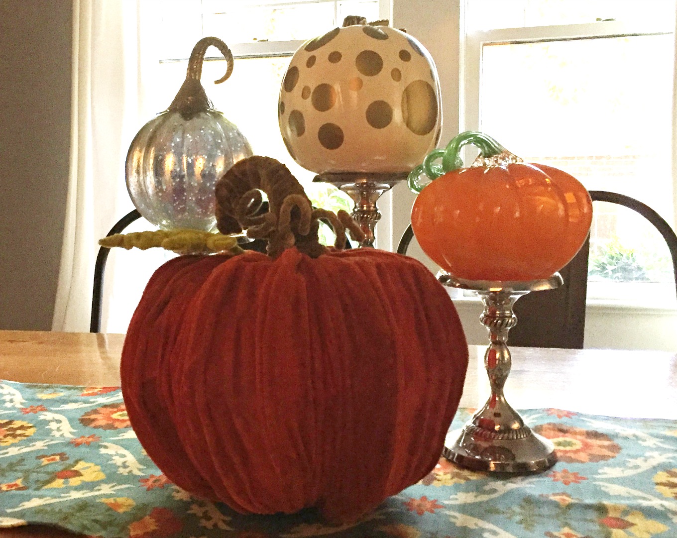 Start with a runner and an assortment of pumpkins for an easy fall centerpiece - thediybungalow.com