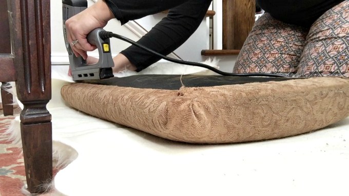 Staple faux fur all the way around DIY faux fur foot stool - thediybungalow.com