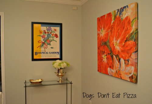 far wall with colorful prints and no big furniture