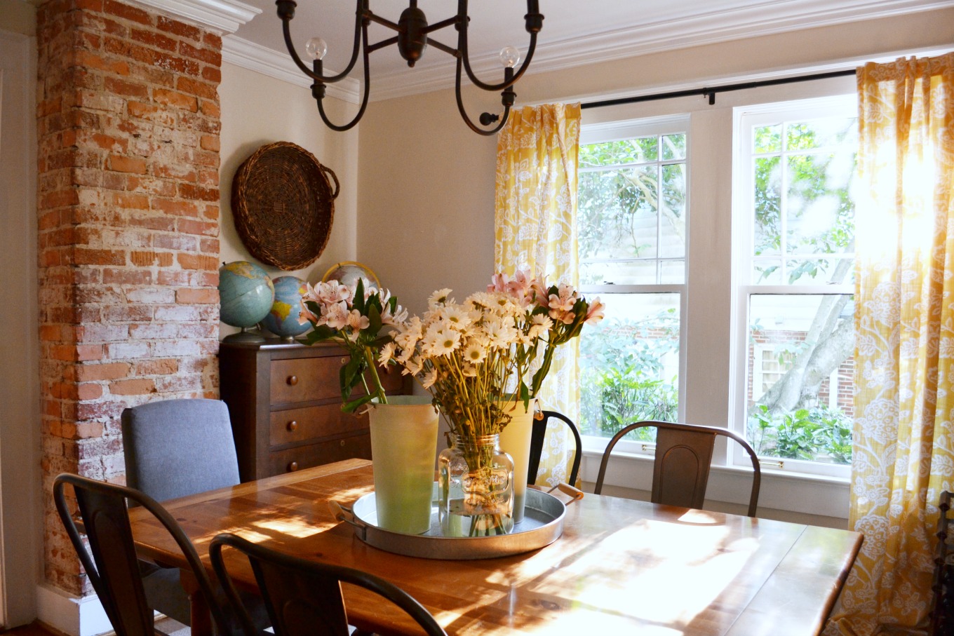 Dining room with fresh flowers to brighten decor for spring - thediybungalow.com
