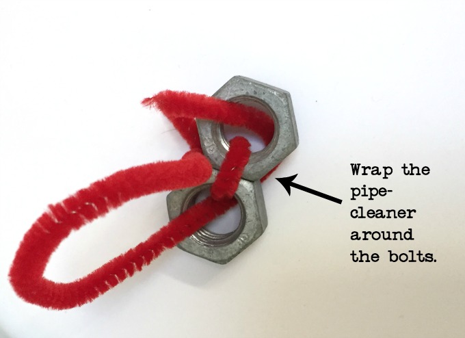 Snowman made from bolts and pipe cleaners turn hardware into holiday decor - thediybungalow.com