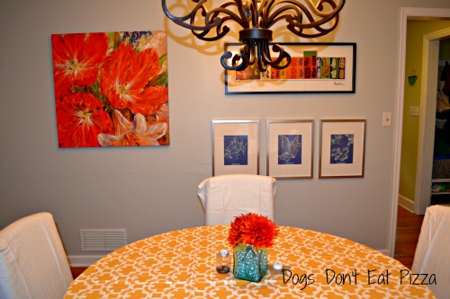 bright dining room with gallery wall