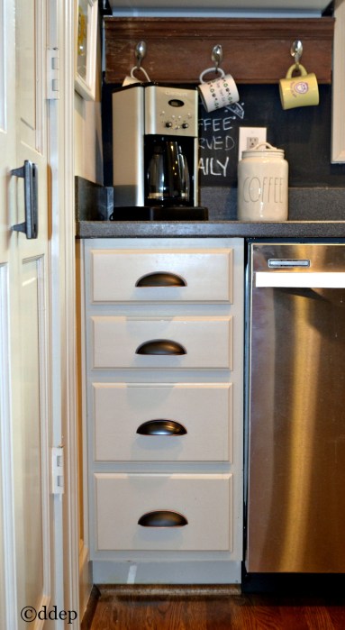Silverware drawers near the dishwasher make for an organized and efficient kitchen - thediybungalow.com
