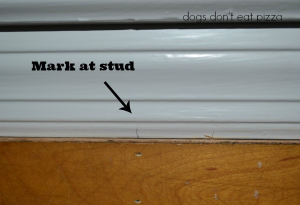 Before nailing the old gym floor up for your DIY headboard, make sure to mark where the studs are - thediybungalow.com