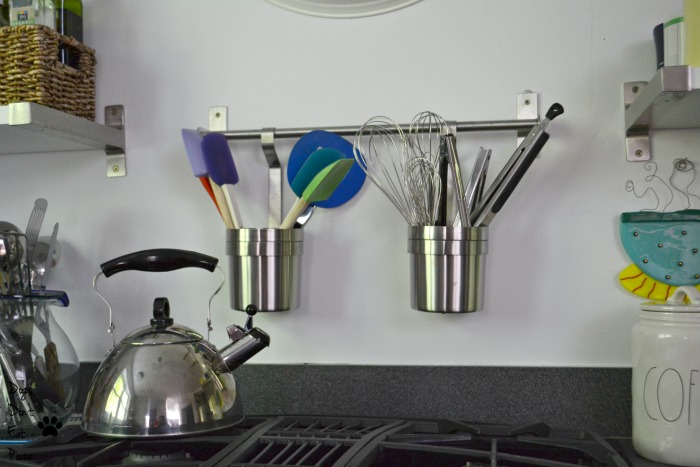 Cooking utensils hanging over stove for an organized and efficient kitchen - thediybungalow.com