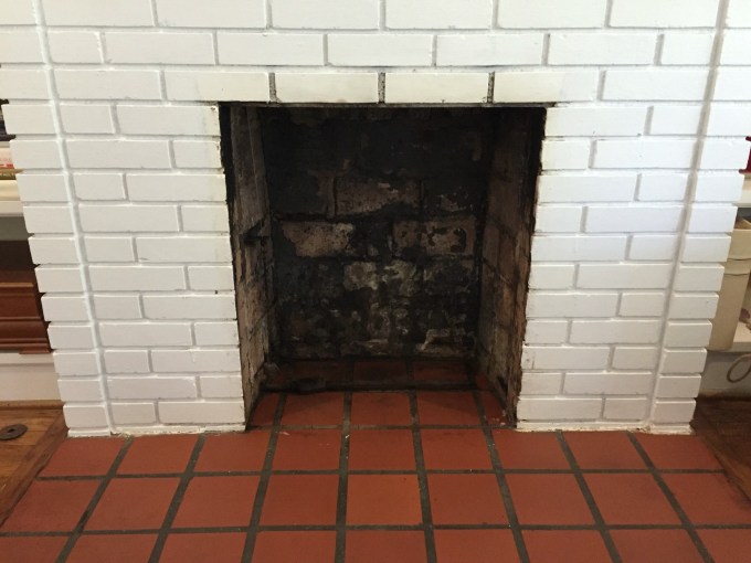 Cleaned fireplace firebox for fireplace makeover - thediybungalow.com