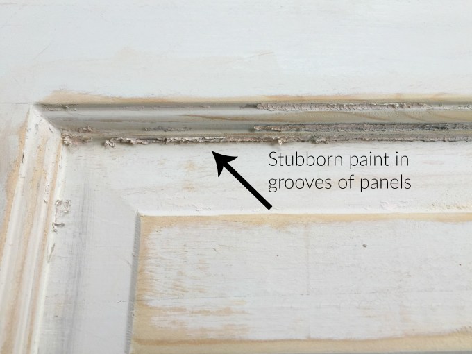 Stubborn paint in grooves of door panel after stripping - thediybungalow.com