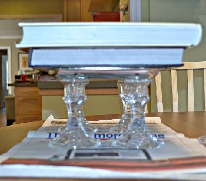 Weighted down the tray with books to create dollar store bathroom tray - thediybungalow.com