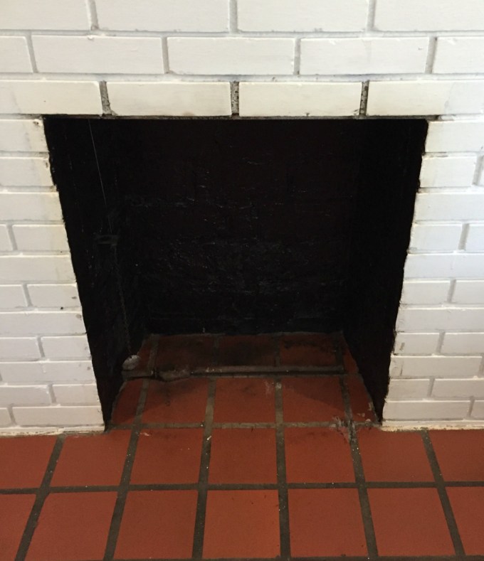 Inside of firebox painted black for fireplace makeover - thediybungalow.com