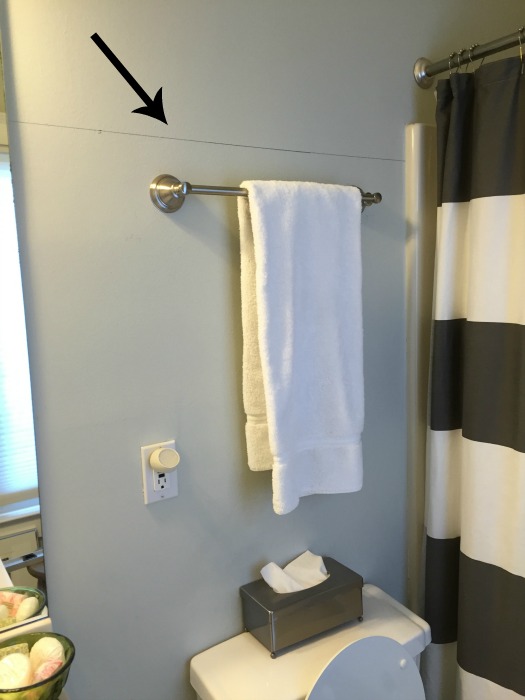 Wainscoting drawn on guest bathroom walls - thediybungalow.com