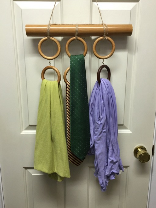 Repurposing curtain hardware - scarf and tie holder hung on back of door - thediybungalow.com