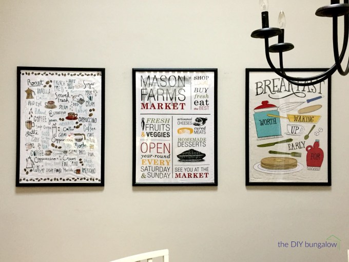 Framed tea towels as art in breakfast room - thediybungalow.com