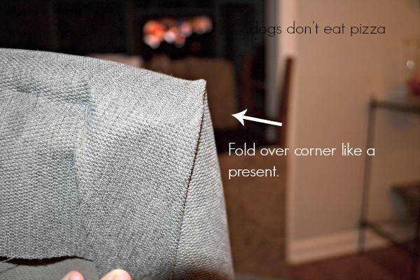 Fold the corners to staple - how to reupholster parsons chairs - thediybungalow.com