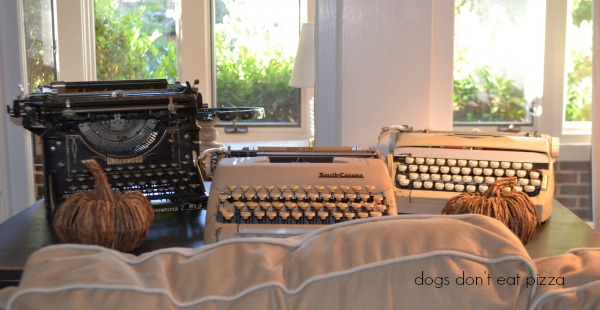Typewriter collection in the living room in the 1929 House - thediybungalow.com