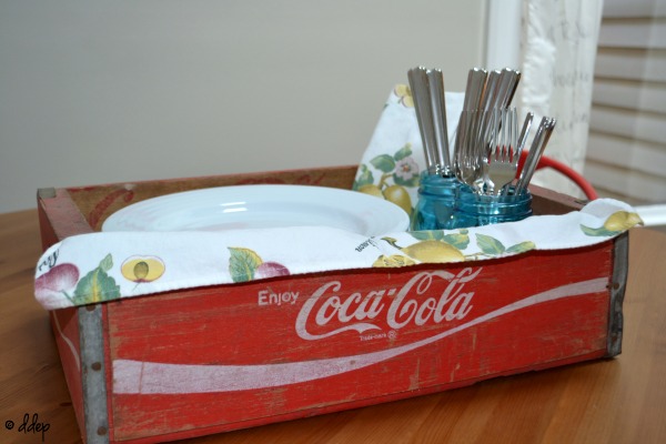 Coke crate as buffet server - Five Ways to Use a Vintage Coke Crate - thediybungalow.com