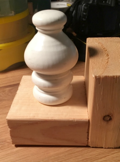 Repurposing curtain hardware - finial as bookend - thediybungalow.com