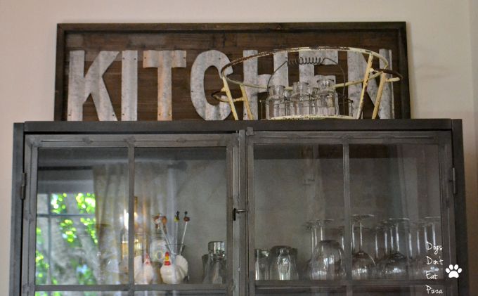 rustic sign on industrial cabinet - dining room - Dogs Don't Eat Pizza