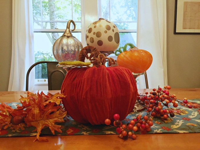 Thanksgiving gratitude - Pumpkins, leaves, and candlesticks make an easy fall centerpiece - thediybungalow.com