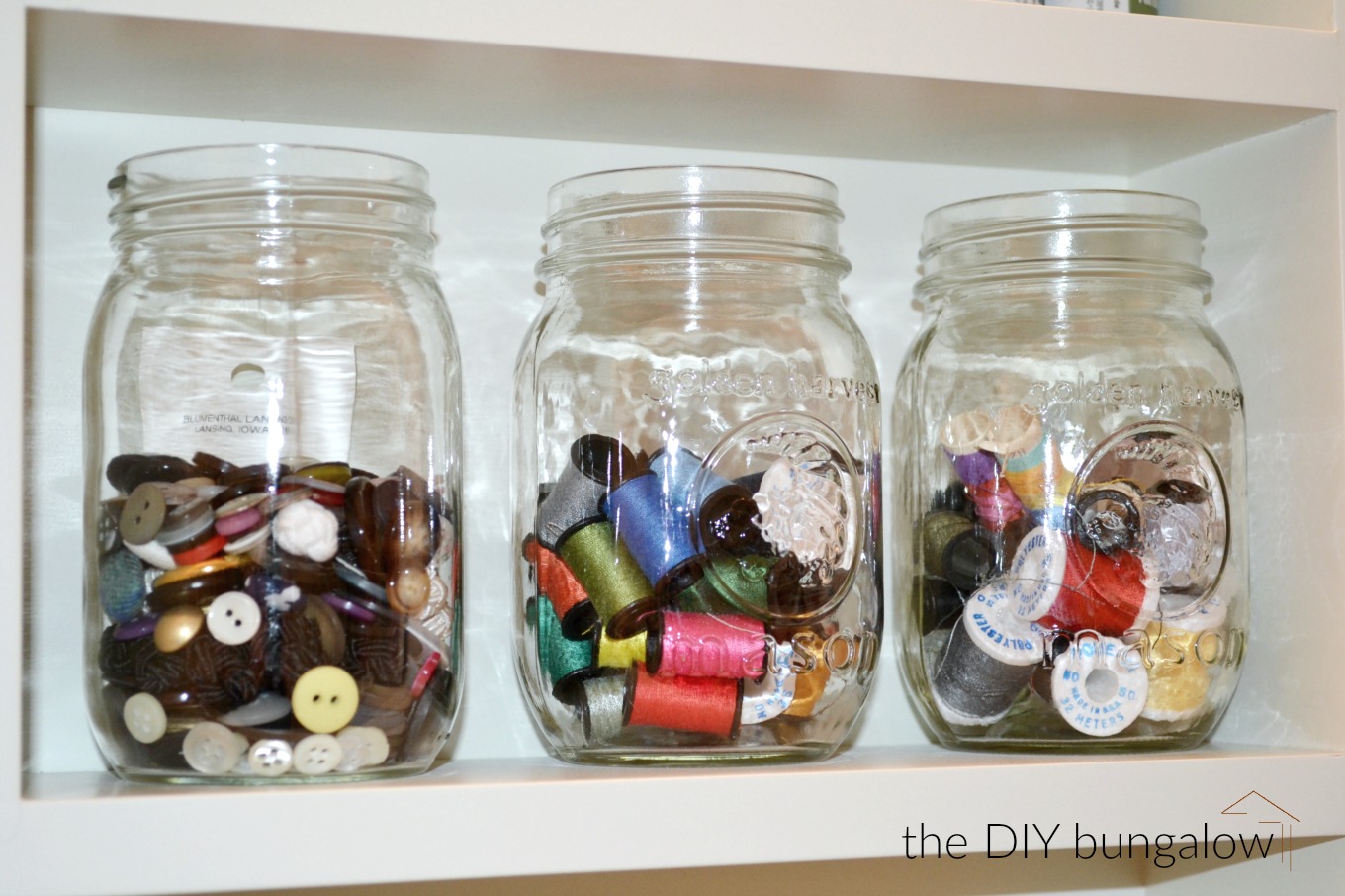 Corral thread and buttons in mason jars to be clutter-free in 2017 - thediybungalow.com