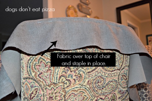 Staple the fabric to the top of the chair in a line - how to reupholster parsons chairs - thediybungalow.com