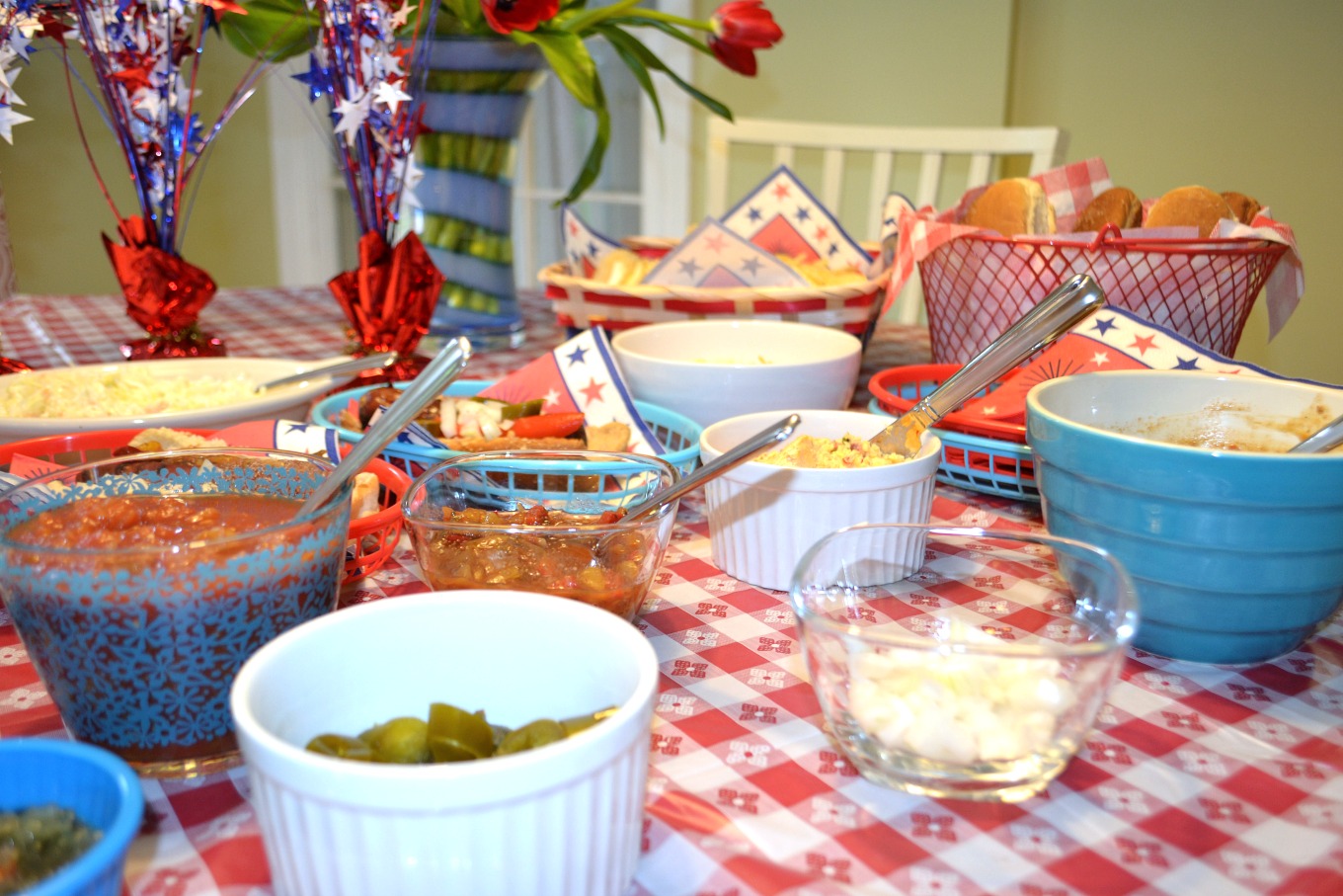 Salsas, onion, peppers, and more as garnish on a DIY hot dog bar - thediybungalow.com