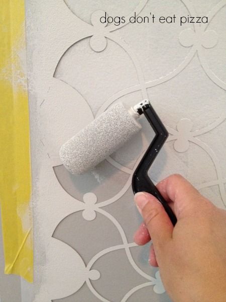 A roller works well for wall stencil - thediybungalow.com