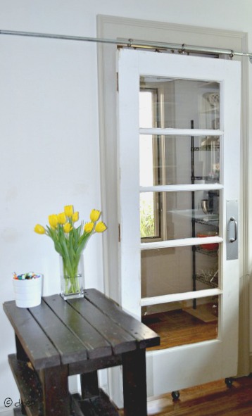 How to turn a door into a sliding door - thediybungalow.com