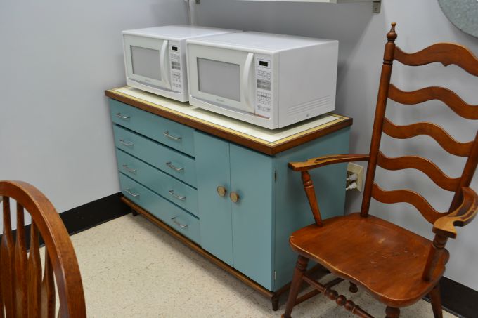 Vintage mid-century modern buffet with two microwaves added to the teachers' lounge renovation - thediybungalow.com
