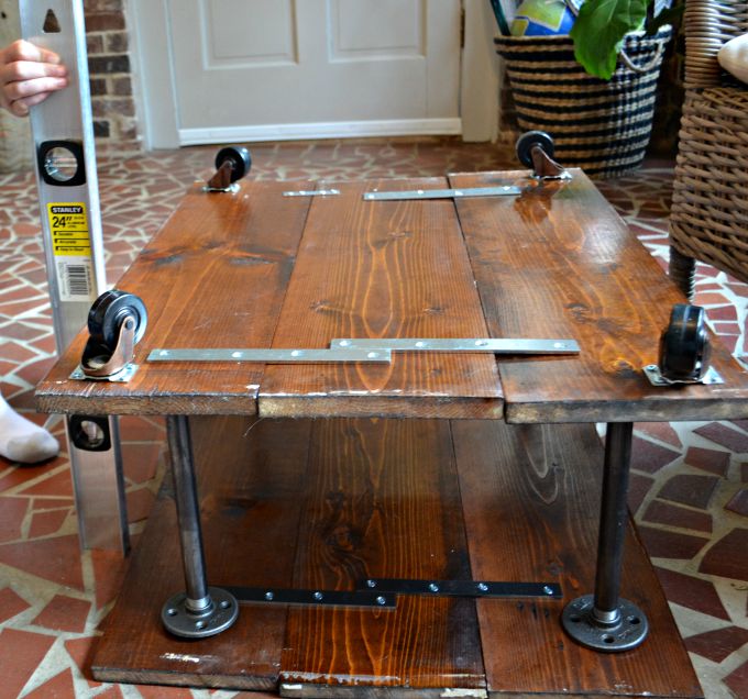 Screw flanges into top boards - DIY two-tier coffee table - Dogs Don't Eat Pizza