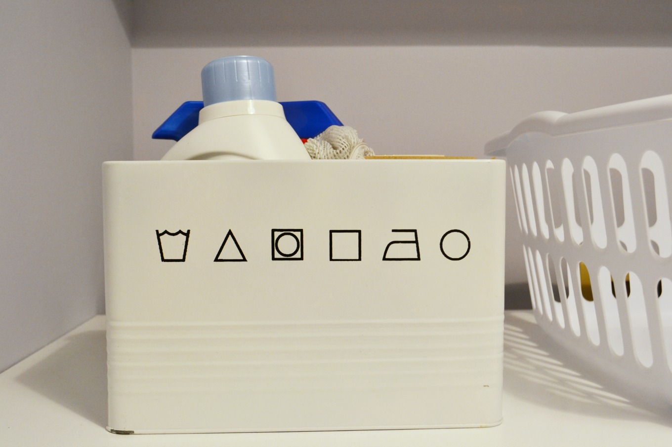 Laundry storage for detergent and stain spray in laundry room reveal - thediybungalow.com