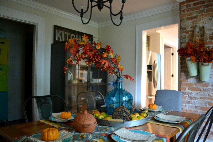Try an unconventional color scheme when decorating for fall like teal with oranges and reds - thediybungalow.com