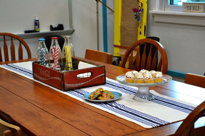 This beautiful table was hiding under oil cloth before in the teachers' lounge renovation - thediybungalow.com