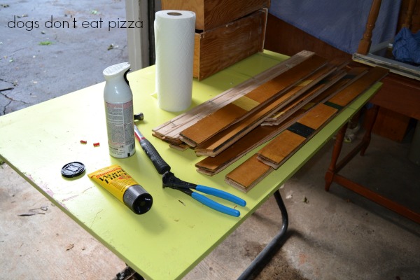 First, use the pliers to remove the nails from the old gym floor - thediybungalow.com