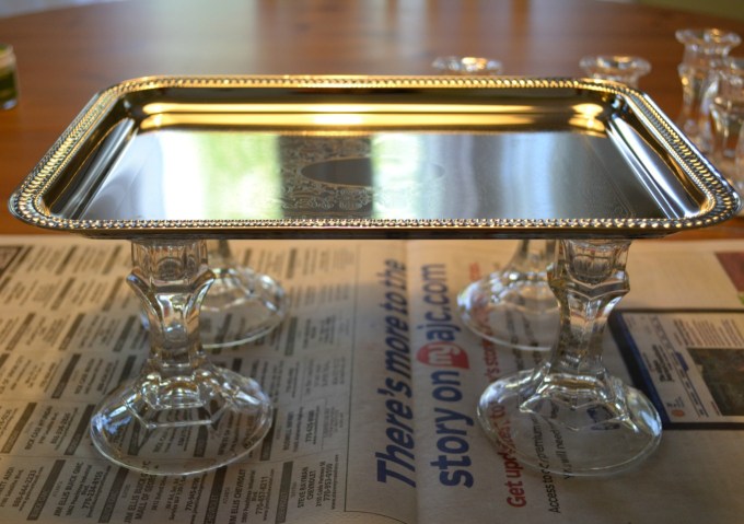 Dollar store tray on top of dollar store candlesticks creates a great bathroom tray - thediybungalow.com