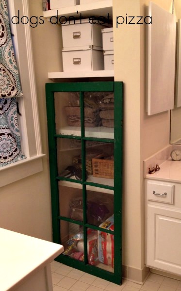 salvaged window as door to cabinet - thediybungalow.com