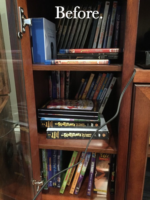 DVDs before - family room tidying up - thediybungalow.com