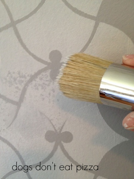Using a brush to touch up the stencil work - thediybungalow.com
