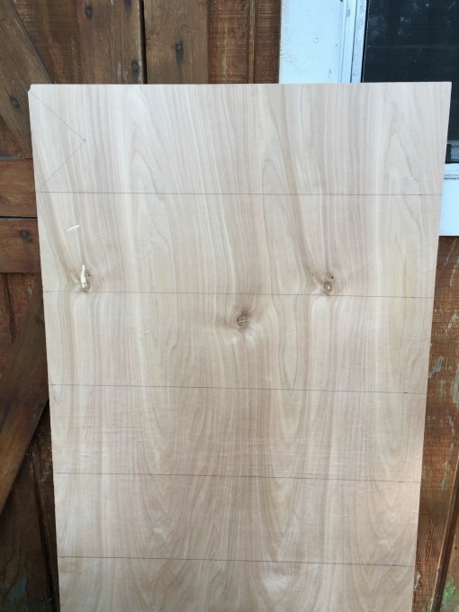 First measure the arrows on the plywood to make the DIY direction sign post - thediybungalow.com