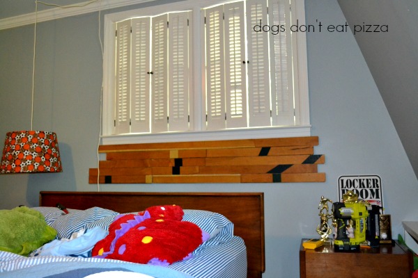 Nailing up the old gym floor to create a DIY headboard - thediybungalow.com