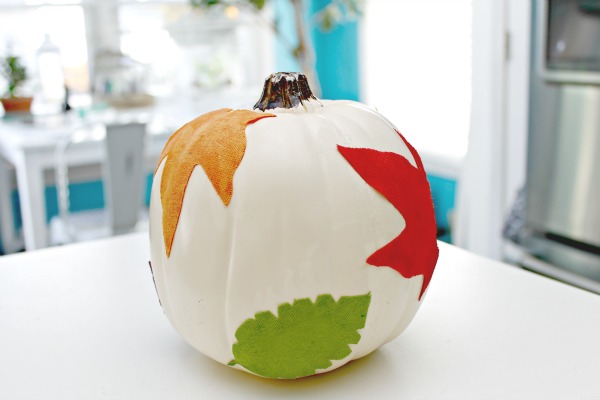 decoupage leaves on pumpkin from Mom4Real / how to dress up craft store pumpkin for Halloween / thediybungalow.com