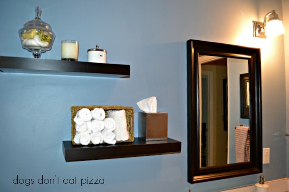 Floating shelves in bathroom balance the room and provide storage - thediybungalow.com