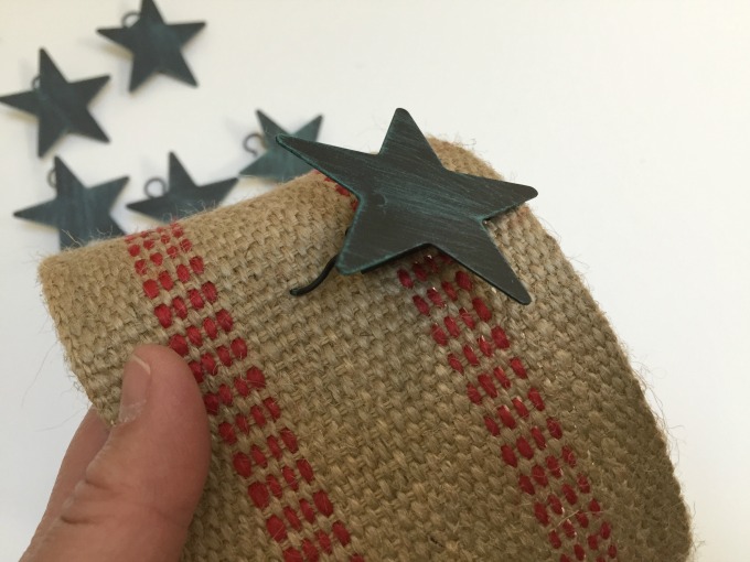 Push curtain clips or rings into webbing to turn hardware into holiday card holder - thediybungalow.com